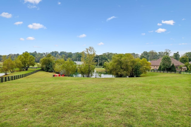 view of yard featuring a rural view and a water view