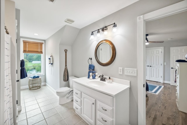 bathroom featuring tile patterned floors, vanity, toilet, and ceiling fan