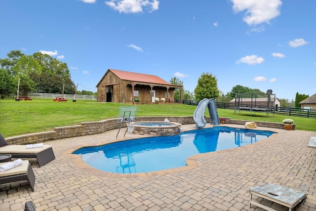 view of swimming pool with an outdoor structure, a yard, an in ground hot tub, and a water slide