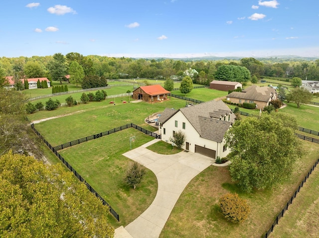 birds eye view of property with a rural view