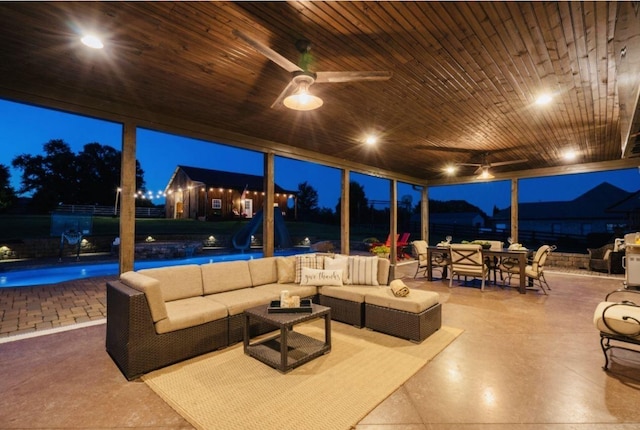 patio at twilight featuring an outdoor hangout area