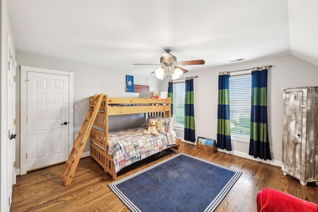 bedroom featuring ceiling fan, wood-type flooring, and lofted ceiling