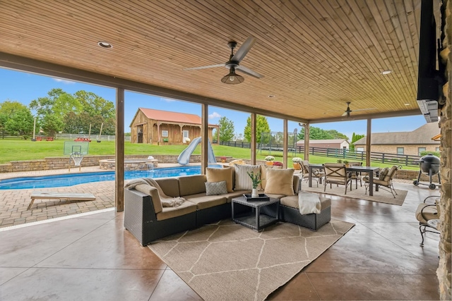 view of patio with ceiling fan, a grill, and an outdoor hangout area