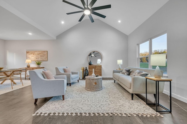 living room with hardwood / wood-style floors, high vaulted ceiling, and ceiling fan