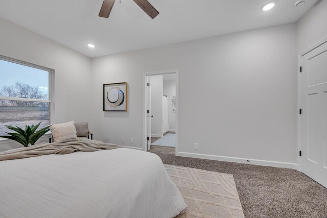 carpeted bedroom featuring ceiling fan