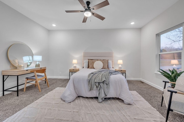 bedroom featuring ceiling fan and light colored carpet