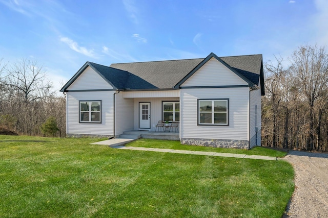 ranch-style house with a porch and a front yard