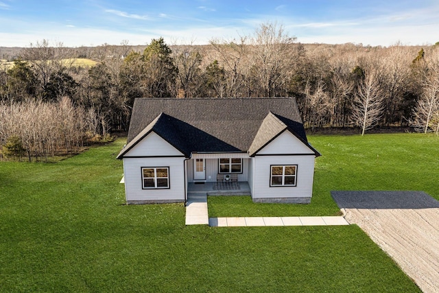 back of house with a lawn and a patio area