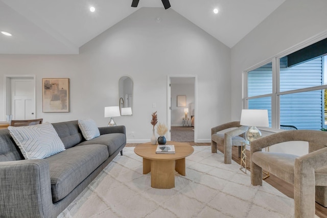 living room with high vaulted ceiling and ceiling fan