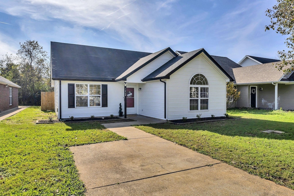 ranch-style home with a front yard