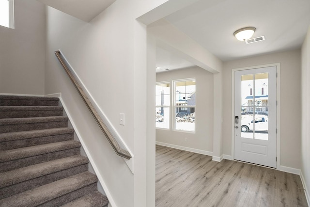 foyer featuring a healthy amount of sunlight and light wood-type flooring