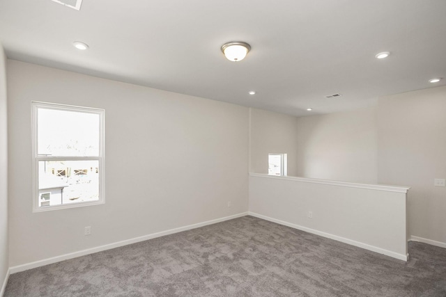 unfurnished room featuring carpet floors