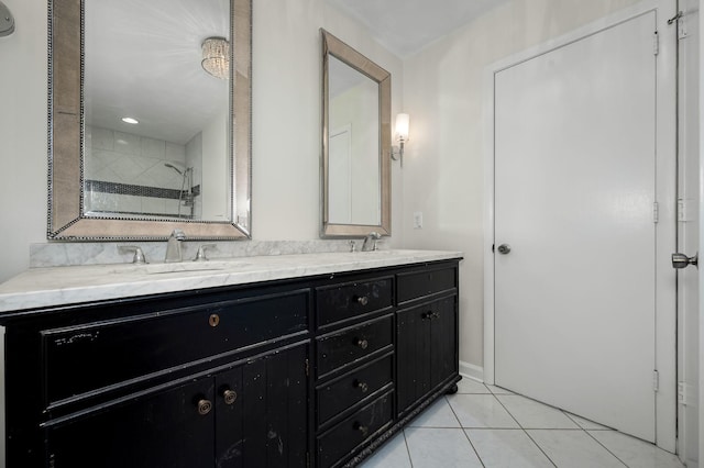 bathroom featuring vanity, tiled shower, and tile patterned floors