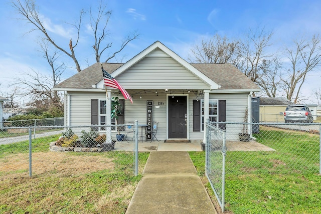 bungalow-style house with a front lawn