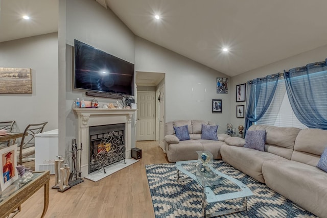 living room featuring hardwood / wood-style floors and lofted ceiling