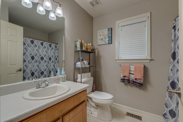 bathroom with vanity and toilet