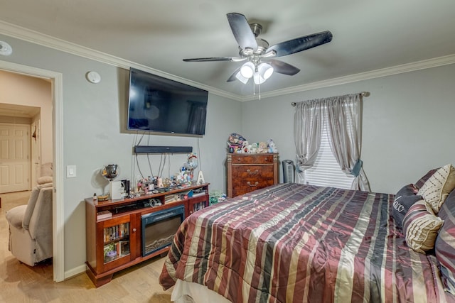 bedroom with light wood-type flooring, ceiling fan, and crown molding