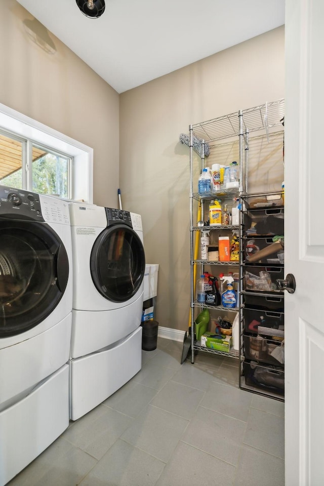 clothes washing area featuring washer and clothes dryer