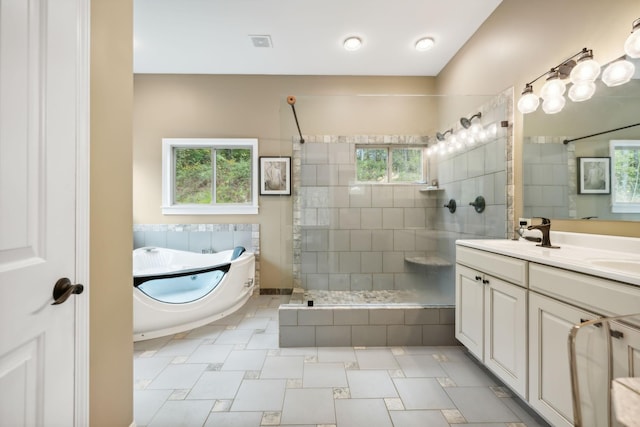 bathroom with vanity and tiled shower