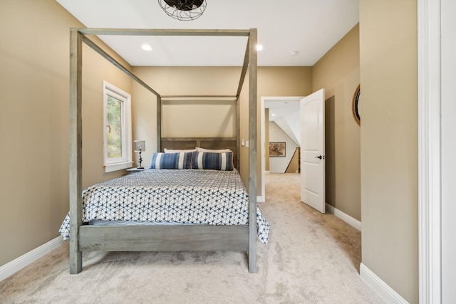 bedroom featuring light carpet