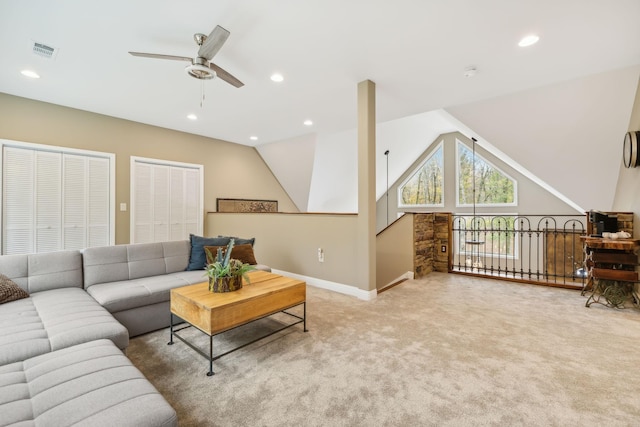 carpeted living room with vaulted ceiling and ceiling fan