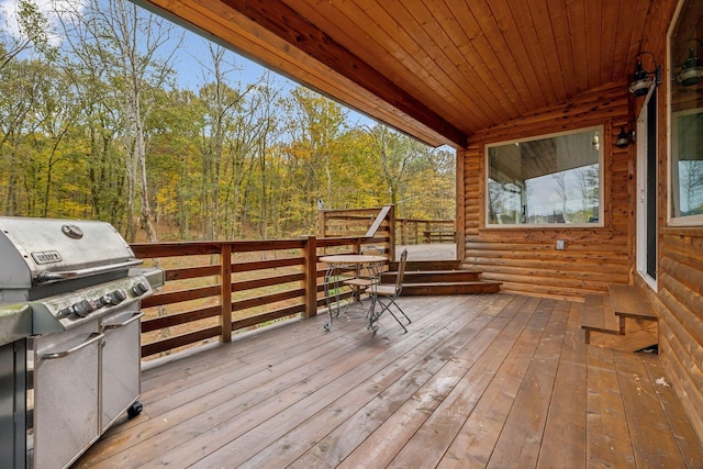 wooden terrace featuring grilling area