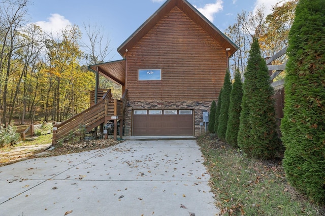 view of side of home with a garage