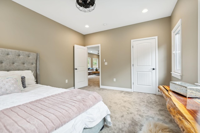 bedroom featuring light carpet