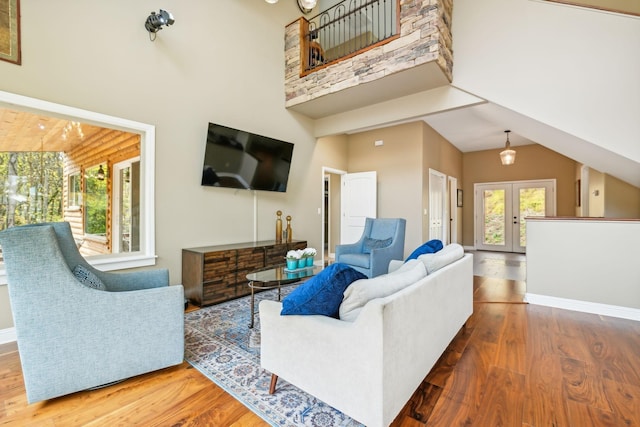 living room featuring wood-type flooring and french doors