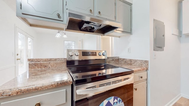 kitchen featuring stainless steel electric stove, electric panel, and french doors