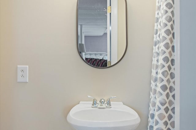 bathroom with sink and walk in shower