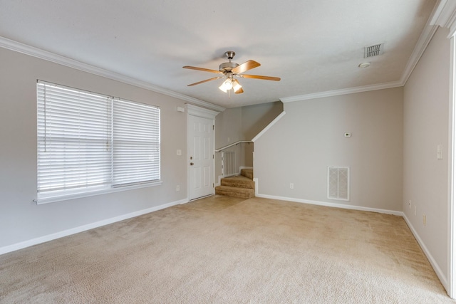 unfurnished living room with ceiling fan, a healthy amount of sunlight, ornamental molding, and light carpet