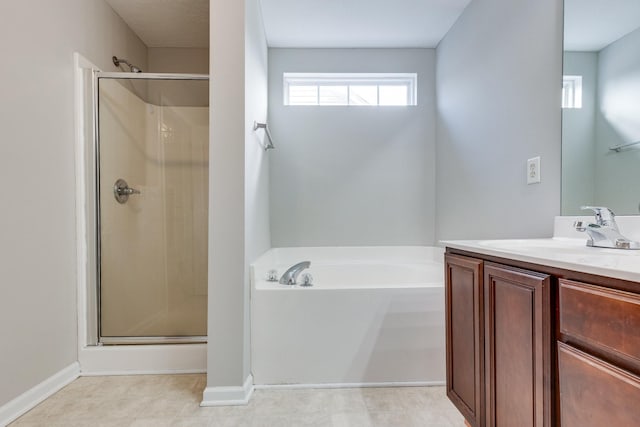 bathroom with shower with separate bathtub and vanity