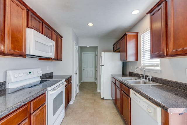 kitchen featuring sink and white appliances