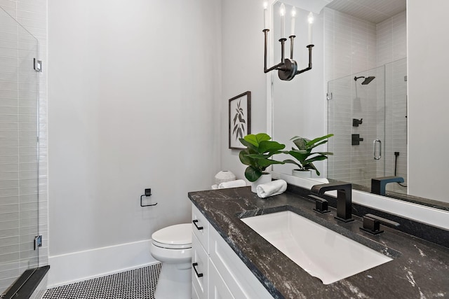 bathroom with vanity, toilet, and an enclosed shower