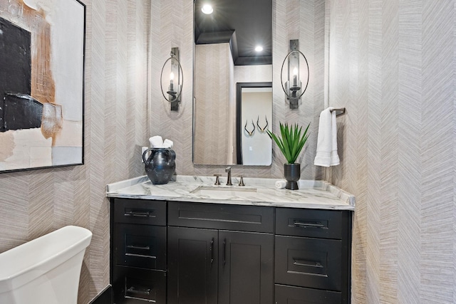 bathroom with vanity and toilet