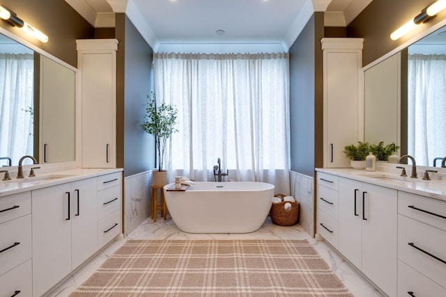 bathroom featuring vanity, a bathtub, and ornamental molding