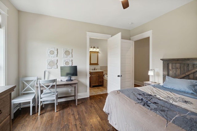 bedroom featuring ensuite bathroom, ceiling fan, and dark hardwood / wood-style floors