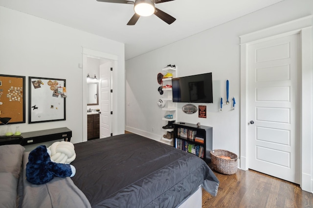 bedroom with ceiling fan, dark hardwood / wood-style floors, and connected bathroom