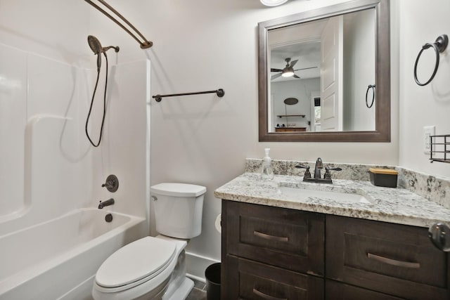 full bathroom featuring vanity, shower / washtub combination, toilet, and ceiling fan