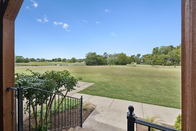 view of yard with a rural view