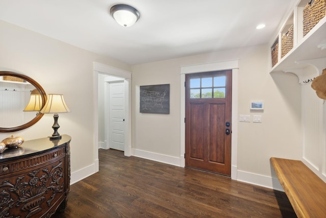 foyer entrance with dark hardwood / wood-style flooring