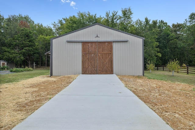 view of outbuilding with a yard