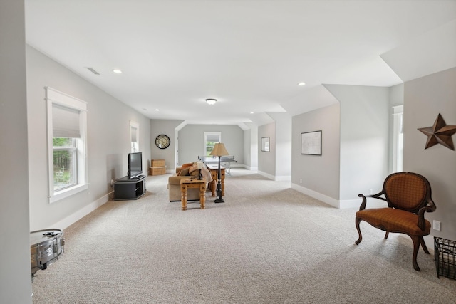 sitting room with light colored carpet