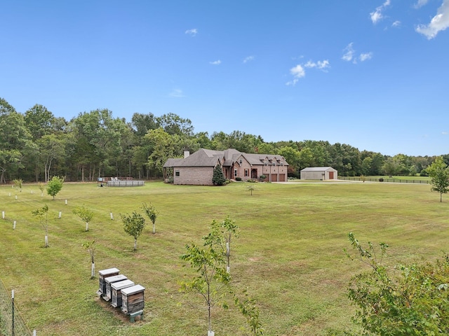 view of yard with a rural view