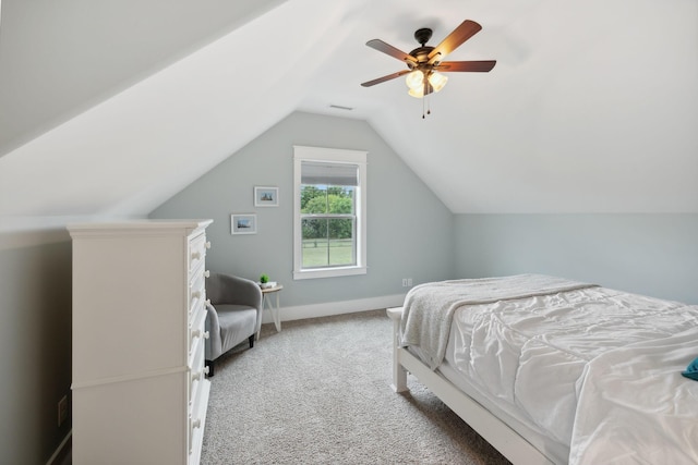 bedroom with ceiling fan, carpet floors, and lofted ceiling