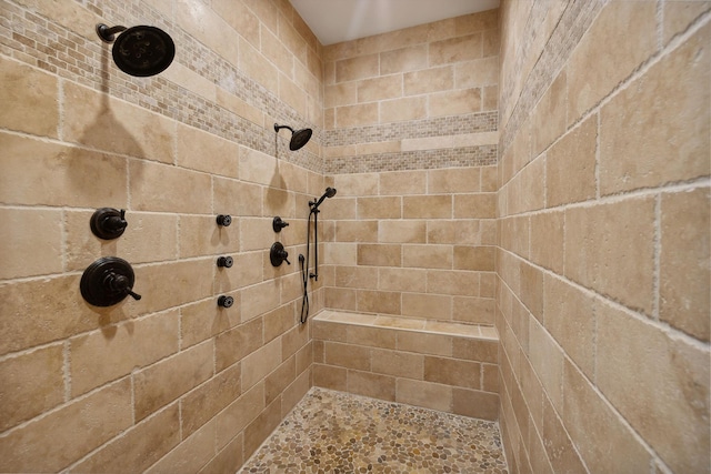 bathroom with tiled shower