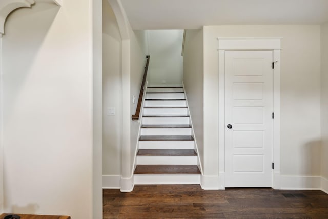 stairs with wood-type flooring