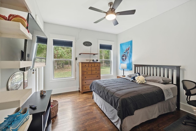 bedroom featuring ceiling fan and dark wood-type flooring