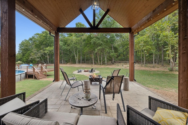 view of patio / terrace featuring an outdoor living space with a fire pit